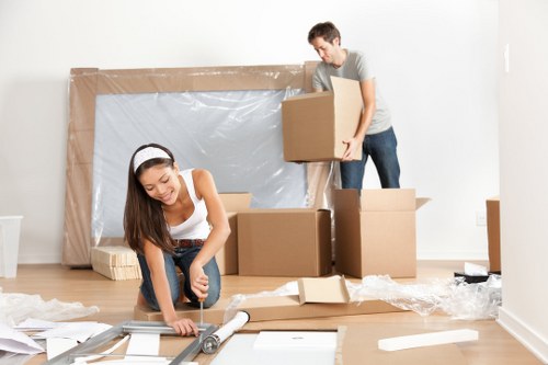 Man and van team loading furniture for a move in Sands End