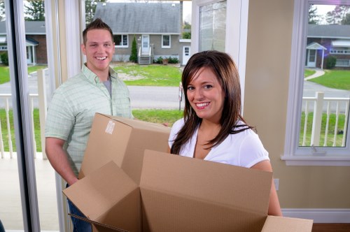 Professional movers loading a van for a Sands End relocation
