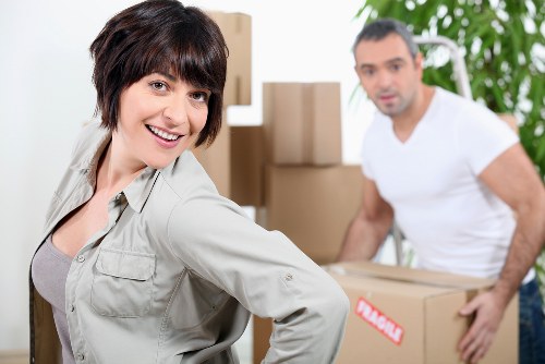 Professional movers handling household items in Sands End