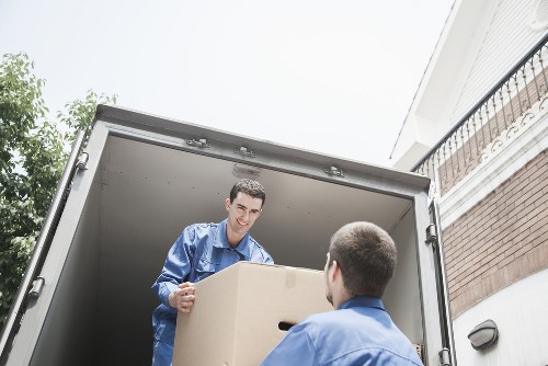 Removal van loading household items in a Sands End street