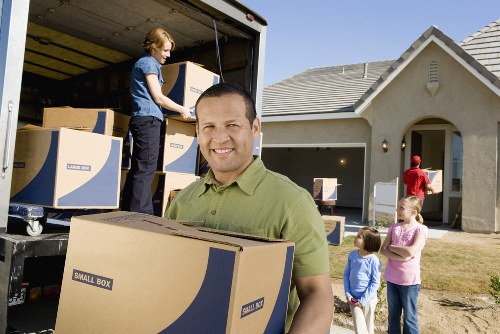 Local office moving team handling furniture and equipment in Sands End