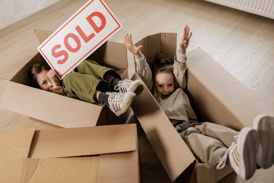 A close-up image of a cardboard box with the word 'Budgeting' printed in large, bold black letters diagonally across the surface. The box appears to be part of a home relocation or moving process, with visible brown corrugated cardboard material. The background is neutral and plain, emphasizing the box and the printed text. This image may relate to affordable or cost-effective moving solutions offered by Man with Van Sands End as part of their removals services, illustrating the planning or packing stage involved in house relocation inside the property or during loading for transportation.